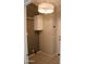 Small laundry room offers storage, lighting, and easy access to other rooms at 749 N 99Th St, Mesa, AZ 85207