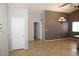 Open concept living area features stylish lighting, neutral paint, and easy access to rooms at 749 N 99Th St, Mesa, AZ 85207