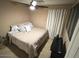 Bedroom featuring bed, a ceiling fan and neutral decor at 7521 S 31St Pl, Phoenix, AZ 85042