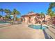 Community hot tub and cabana area surrounded by palm trees in a fenced area at 7521 S 31St Pl, Phoenix, AZ 85042