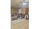 Spacious living room features sectional sofa and neutral decor at 7521 S 31St Pl, Phoenix, AZ 85042