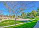 Exterior view of the community sand volleyball court surrounded by grassy areas and walking path at 7521 S 31St Pl, Phoenix, AZ 85042