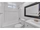 Bathroom with tub, toilet, modern sink and fixtures at 7614 W Cheery Lynn Rd, Phoenix, AZ 85033