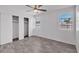 Bedroom features a closet, tile floors, and secured window at 7614 W Cheery Lynn Rd, Phoenix, AZ 85033