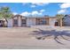 Charming single-story home featuring brick accents and a low-maintenance gravel front yard at 7614 W Cheery Lynn Rd, Phoenix, AZ 85033