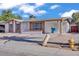 Quaint single-story home with a covered parking area, complemented by a neat front yard at 7614 W Cheery Lynn Rd, Phoenix, AZ 85033