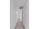 Hallway featuring wood-style floors, neutral walls, and simple lighting at 7614 W Cheery Lynn Rd, Phoenix, AZ 85033