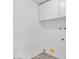 This laundry room features white walls and tile floors at 7614 W Cheery Lynn Rd, Phoenix, AZ 85033