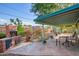 Beautiful backyard featuring a cozy fireplace and an elegant brick barbecue at 811 W Ocotillo Rd, Phoenix, AZ 85013