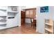 Basement featuring shelving, wood floors, and desk, perfect for work or storage at 811 W Ocotillo Rd, Phoenix, AZ 85013