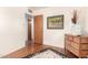 Bedroom featuring wood floors, art on the walls, and a doorway leading to other rooms at 811 W Ocotillo Rd, Phoenix, AZ 85013