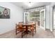 Cozy dining area with neutral carpet and French doors that open onto a patio at 811 W Ocotillo Rd, Phoenix, AZ 85013