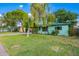 Charming home featuring a lush lawn, mature trees, and a quaint facade at 811 W Ocotillo Rd, Phoenix, AZ 85013