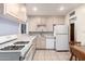 Functional kitchen featuring a gas range, neutral countertops, and plenty of cabinet space at 811 W Ocotillo Rd, Phoenix, AZ 85013
