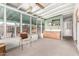 Bright sunroom with abundant windows, a comfortable seating area, and a view of the outdoors at 811 W Ocotillo Rd, Phoenix, AZ 85013