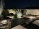 Backyard landscape with accent lighting around the pool and patio area at 8420 W Cherry Hills Dr, Peoria, AZ 85345