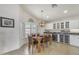 Open dining area boasts bright window, pendant lighting, and adjacent wine refrigerator at 8420 W Cherry Hills Dr, Peoria, AZ 85345