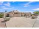 Charming single-story home with a wide driveway and well-maintained landscaping at 8420 W Cherry Hills Dr, Peoria, AZ 85345