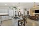 Bright kitchen with center island, tile flooring, stainless appliances, and an easy flow to living areas at 8420 W Cherry Hills Dr, Peoria, AZ 85345