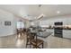 Well-equipped kitchen with granite countertops, white cabinetry, modern appliances, and an adjacent dining area at 8420 W Cherry Hills Dr, Peoria, AZ 85345