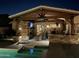 Outdoor covered patio with a grill, fireplace and patio furniture at 8420 W Cherry Hills Dr, Peoria, AZ 85345