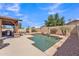 Beautiful backyard pool with a covered outdoor kitchen and seating area at 8420 W Cherry Hills Dr, Peoria, AZ 85345