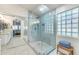 Large, luxurious bathroom with glass enclosed shower and dual sink vanity with marble countertops at 8420 W Cherry Hills Dr, Peoria, AZ 85345
