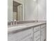 Bathroom featuring a large mirror, dual vanity and white cabinets at 9733 E Axle Ave, Mesa, AZ 85212