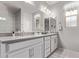 Bathroom with dual sinks, large mirror, and ample counter space at 9733 E Axle Ave, Mesa, AZ 85212