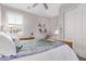 Bedroom with carpet flooring, ceiling fan, window, a bed and closet at 9733 E Axle Ave, Mesa, AZ 85212