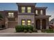 Charming two-story home with a neutral color palette, arched entry, and well-manicured landscaping at 9733 E Axle Ave, Mesa, AZ 85212