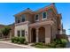Charming two-story home features a tile roof, arched entryway, manicured landscaping, and beautiful stone accents at 9733 E Axle Ave, Mesa, AZ 85212