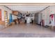 Spacious garage with epoxy floors, storage solutions and a functional layout at 9733 E Axle Ave, Mesa, AZ 85212