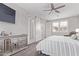 Serene main bedroom featuring a comfortable bed, sliding barn doors, and elegant decor at 9733 E Axle Ave, Mesa, AZ 85212