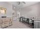 Home office with wood-look tile floors and modern grey decor, featuring dual workstations and stylish storage at 9733 E Axle Ave, Mesa, AZ 85212