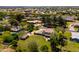 Aerial view showcasing a property with a spacious backyard, mature trees, and convenient shed at 10532 W Catalina Dr, Avondale, AZ 85392