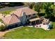 Aerial view of a well-maintained yard with patio, hot tub, and outdoor kitchen area at 10532 W Catalina Dr, Avondale, AZ 85392