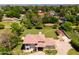 An aerial view of a residence showcasing its sizable lot, mature trees, and serene surroundings at 10532 W Catalina Dr, Avondale, AZ 85392
