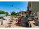 Outdoor patio with outdoor kitchen, grill, seating and entertainment space at 10532 W Catalina Dr, Avondale, AZ 85392