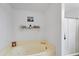 Bathroom view of the tub, shower, and shelf at 10532 W Catalina Dr, Avondale, AZ 85392