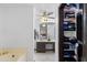 An ensuite bathroom showing the bathtub and large closet space at 10532 W Catalina Dr, Avondale, AZ 85392