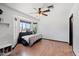 Bedroom area with a bay window and daybed with decorative pillows at 10532 W Catalina Dr, Avondale, AZ 85392