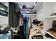 Organized closet with clothes and shoes on shelves at 10532 W Catalina Dr, Avondale, AZ 85392