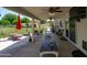 Large covered patio featuring ceiling fans, outdoor furniture, and access to the spacious backyard at 10532 W Catalina Dr, Avondale, AZ 85392