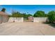 Large driveway and gated access at the rear of the property, adding an element of security at 10532 W Catalina Dr, Avondale, AZ 85392