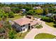 Sprawling home with pristine landscaping, circular driveway, and tiled roof in a quiet residential neighborhood at 10532 W Catalina Dr, Avondale, AZ 85392