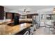 An eat-in kitchen area features modern stainless steel appliances and dark wood cabinetry at 10532 W Catalina Dr, Avondale, AZ 85392
