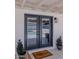 A beautiful patio door with a welcome mat leading to a gorgeous pool area at 10609 N 32Nd Cir, Phoenix, AZ 85029