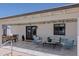 An outdoor seating area including sofas, chairs and a dining table on a tiled patio at 10609 N 32Nd Cir, Phoenix, AZ 85029