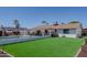 This backyard showcases a well-maintained lawn and a sparkling pool, ideal for summer relaxation and entertainment at 10609 N 32Nd Cir, Phoenix, AZ 85029